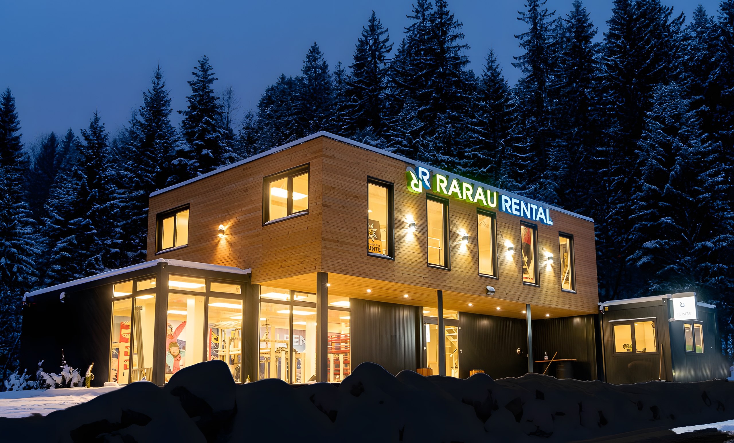 Clădirea Rarău Rental, luminată într-o seară de iarnă